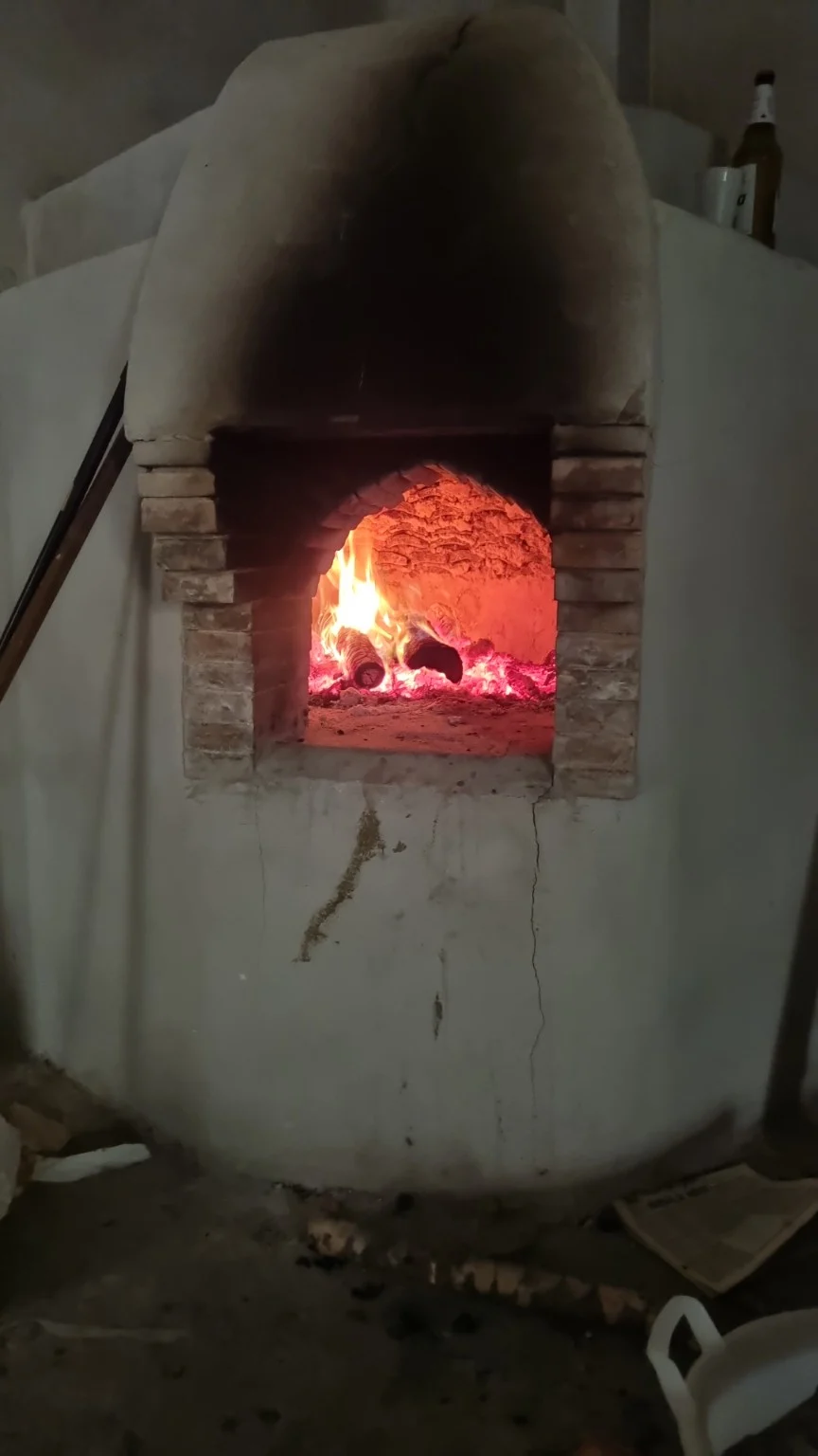The glow of the wood-fired oven
