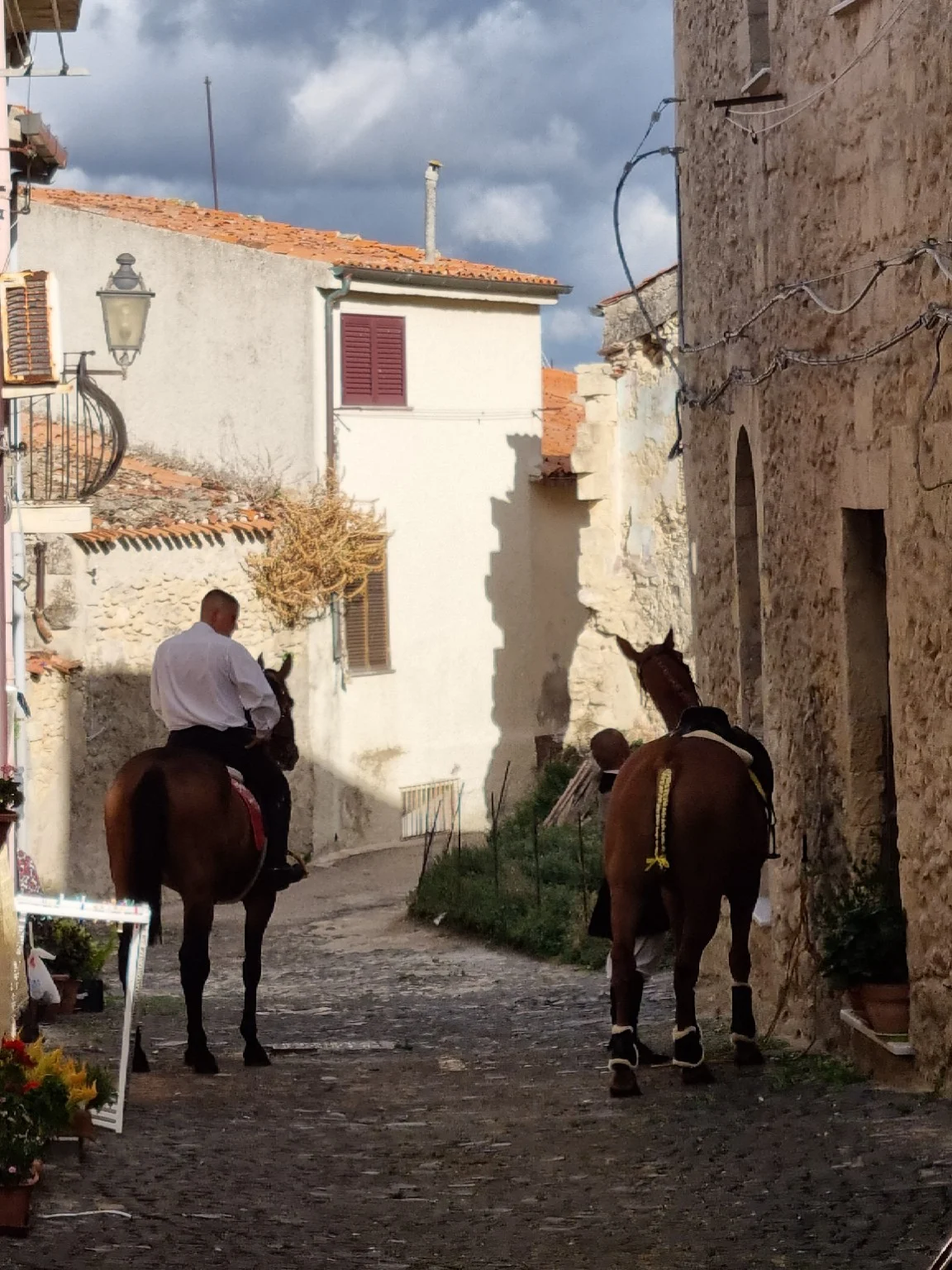 Riders passing through the village streets
